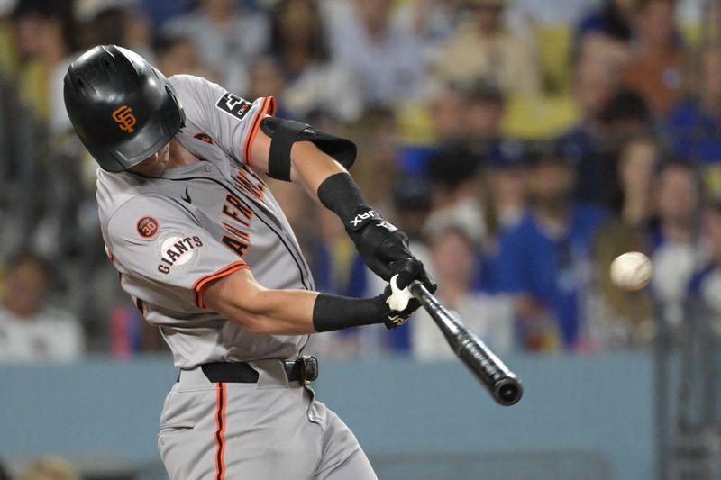 Jul 22, 2024; Los Angeles, California, USA;  San Francisco Giants third baseman Matt Chapman (26) hits a solo home run in the seventh inning against the Los Angeles Dodgers at Dodger Stadium. Mandatory Credit: Jayne Kamin-Oncea-USA TODAY Sports