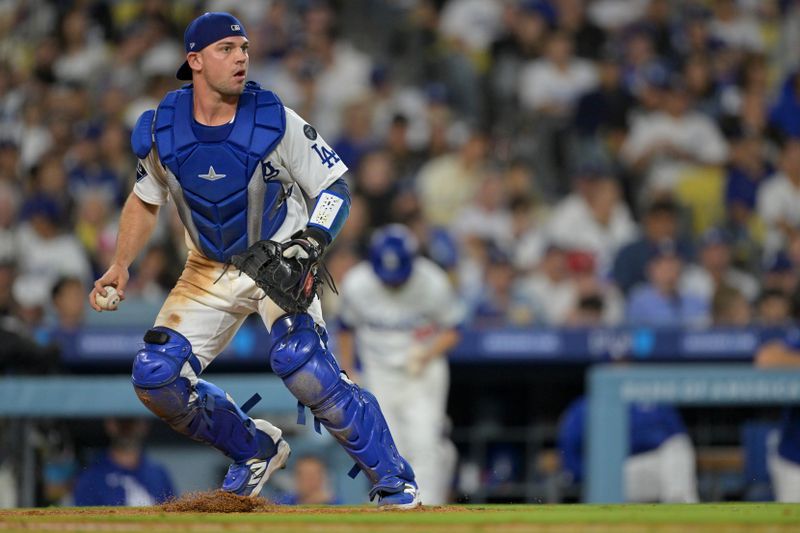 Sep 10, 2025; Los Angeles, California, USA;  Los Angeles Dodgers catcher Ben Rortvedt (47) makes a play against the Colorado Rockies at Dodger Stadium. Mandatory Credit: Jayne Kamin-Oncea-Imagn Images
