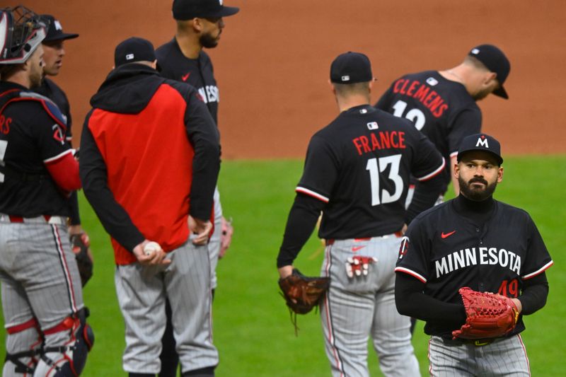 Apr 30, 2025; Cleveland, Ohio, USA; Minnesota Twins starting pitcher Pablo Lopez (49) walks to the dugout during a pitching change in the seventh inning against the Cleveland Guardians at Progressive Field. Mandatory Credit: David Richard-Imagn Images