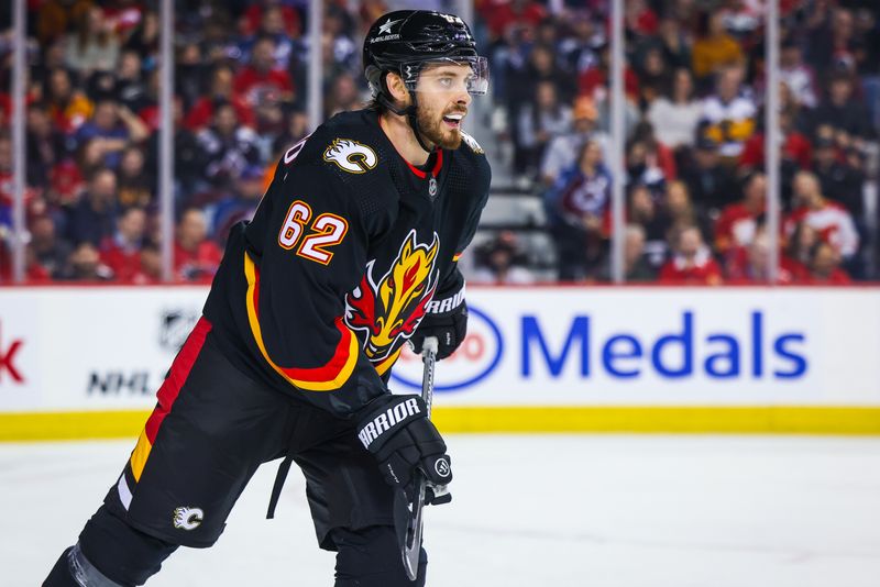 Mar 12, 2024; Calgary, Alberta, CAN; Calgary Flames defenseman Daniil Miromanov (62) skates against the Colorado Avalanche during the third period at Scotiabank Saddledome. Mandatory Credit: Sergei Belski-USA TODAY Sports