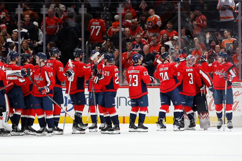 Mar 1, 2024; Washington, District of Columbia, USA; Washington Capitals players celebrate after their game against the Philadelphia Flyers at Capital One Arena. Mandatory Credit: Geoff Burke-USA TODAY Sports