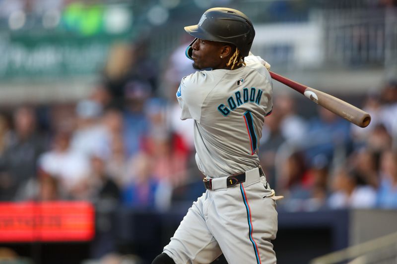 Apr 22, 2024; Atlanta, Georgia, USA; Miami Marlins left fielder Nick Gordon (1) hits a single against the Atlanta Braves in the second inning at Truist Park. Mandatory Credit: Brett Davis-USA TODAY Sports