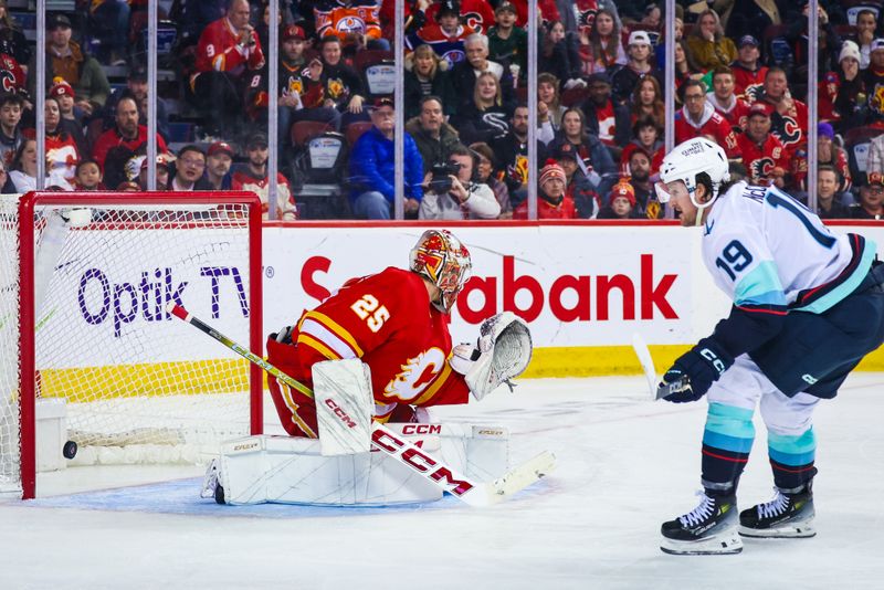 Mar 4, 2024; Calgary, Alberta, CAN; Seattle Kraken left wing Jared McCann (19) scores a goal against Calgary Flames goaltender Jacob Markstrom (25) during the third period at Scotiabank Saddledome. Mandatory Credit: Sergei Belski-USA TODAY Sports