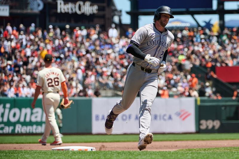 May 19, 2024; San Francisco, California, USA; Colorado Rockies infielder Ryan McMahon (24) runs the bases after hitting a one run home run against the San Francisco Giants during the first inning at Oracle Park. Mandatory Credit: Robert Edwards-USA TODAY Sports