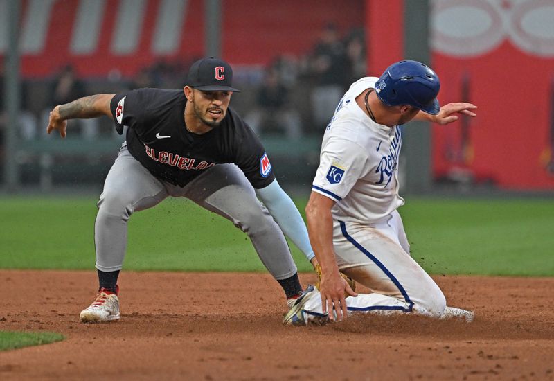 Jun 27, 2024; Kansas City, Missouri, USA; Cleveland Guardians shortstop Gabriel Arias (13) tags out Kansas City Royals Hunter Renfroe (16) at second base in the third inning at Kauffman Stadium. Mandatory Credit: Peter Aiken-USA TODAY Sports