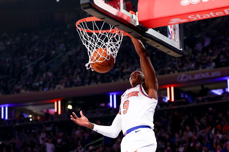 NEW YORK, NEW YORK - DECEMBER 25:  RJ Barrett #9 of the New York Knicks dunks during the first quarter of the game against the Milwaukee Bucks at Madison Square Garden on December 25, 2023 in New York City.  NOTE TO USER: User expressly acknowledges and agrees that, by downloading and or using this photograph, User is consenting to the terms and conditions of the Getty Images License Agreement. (Photo by Rich Graessle/Getty Images)