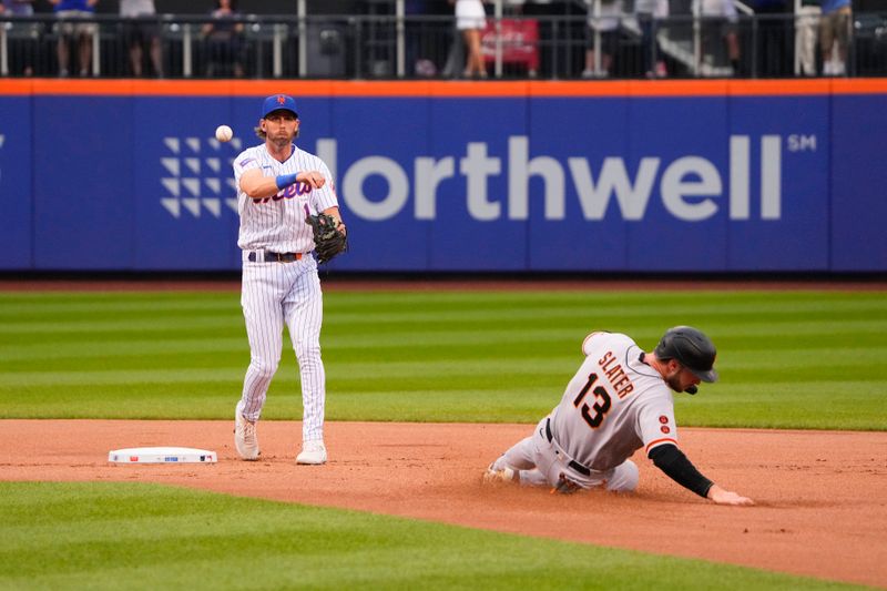 Jul 2, 2023; New York City, New York, USA; New York Mets second baseman Jeff McNeil (1) throws to first base to complete a double play with San Francisco Giants left fielder Austin Slater (13) sliding into second base during the first inning at Citi Field. Mandatory Credit: Gregory Fisher-USA TODAY Sports