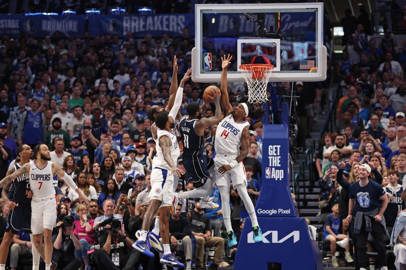 DALLAS, TX - APRIL 28: Kyrie Irving #11 of the Dallas Mavericks shoots the ball during the game against the LA Clippers during Round 1 Game 4 of the 2024 NBA Playoffs on April 28, 2024 at the American Airlines Center in Dallas, Texas. NOTE TO USER: User expressly acknowledges and agrees that, by downloading and or using this photograph, User is consenting to the terms and conditions of the Getty Images License Agreement. Mandatory Copyright Notice: Copyright 2024 NBAE (Photo by Tim Heitman/NBAE via Getty Images)