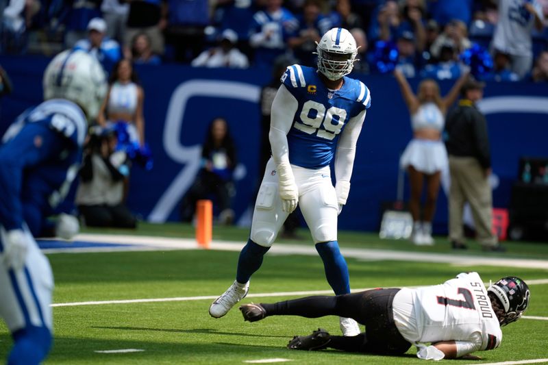 Indianapolis Colts defensive tackle DeForest Buckner (99) sacks Houston Texans quarterback C.J. Stroud (7) during the first half of an NFL football game against the Houston Texans, Sunday, Sept. 8, 2024, in Indianapolis. (AP Photo/Darron Cummings)