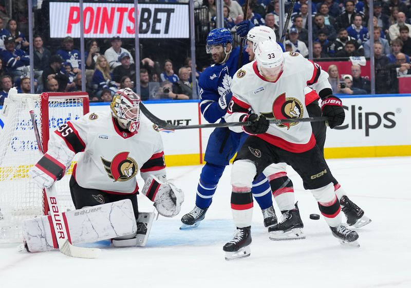 Apr 29, 2025; Toronto, Ontario, CAN; Toronto Maple Leafs left wing Max Pacioretty (67) battles for the puck with Ottawa Senators defenseman Nikolas Matinpalo (33) in the third period during game five of the first round of the 2025 Stanley Cup Playoffs at Scotiabank Arena. Mandatory Credit: Nick Turchiaro-Imagn Images