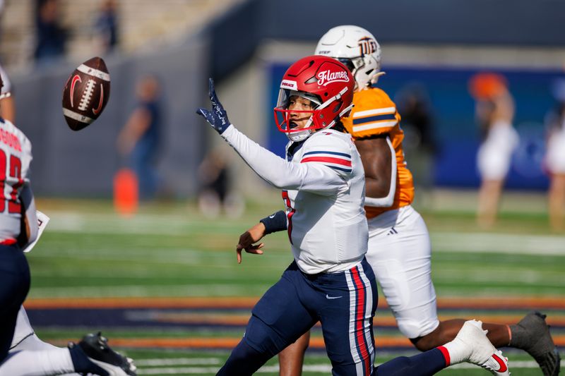 Nov 25, 2023; El Paso, Texas, USA; No. 22 Liberty Flames quarterback Kaidon Salter (7) pitches the ball to a teammate during a play against the UTEP Miners defense during the first half at Sun Bowl Stadium. Mandatory Credit: Ivan Pierre Aguirre-USA TODAY Sports