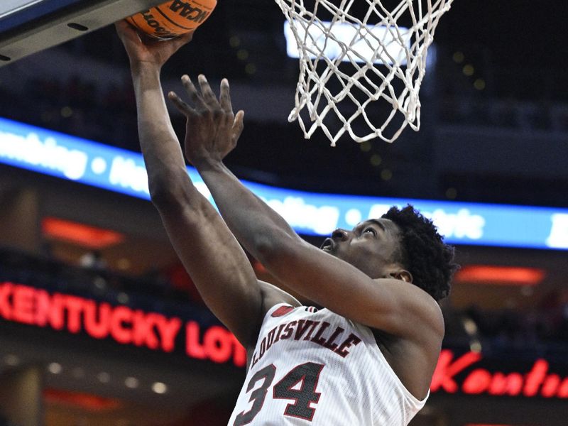 Nov 26, 2023; Louisville, Kentucky, USA;  Louisville Cardinals forward Emmanuel Okorafor (34) shoots against the New Mexico State Aggies during the second half at KFC Yum! Center. Louisville defeated New Mexico State 90-84. Mandatory Credit: Jamie Rhodes-USA TODAY Sports