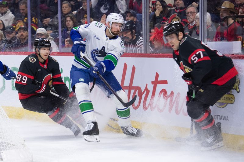 Jan 13, 2026; Ottawa, Ontario, CAN; Ottawa Senators left wing David Perron (57) blocks a pass from Vancouver Canucks defenseman Marcus Pettersson (29) in the first period at the Canadian Tire Centre. Mandatory Credit: Marc DesRosiers-IMAGN Images