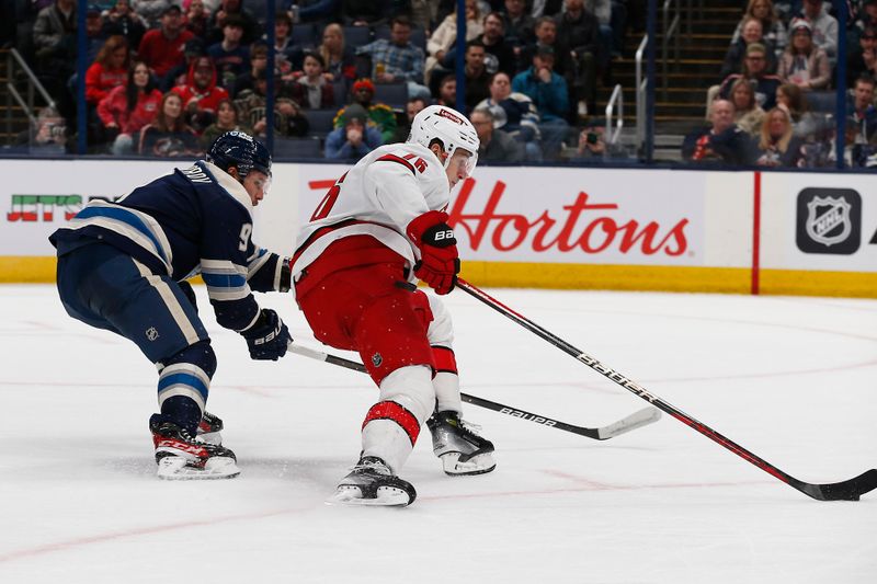 Feb 29, 2024; Columbus, Ohio, USA; Carolina Hurricanes defenseman Brady Skjei (76) carries the puck as Columbus Blue Jackets defenseman Ivan Provorov (9) defends during the second period at Nationwide Arena. Mandatory Credit: Russell LaBounty-USA TODAY Sports