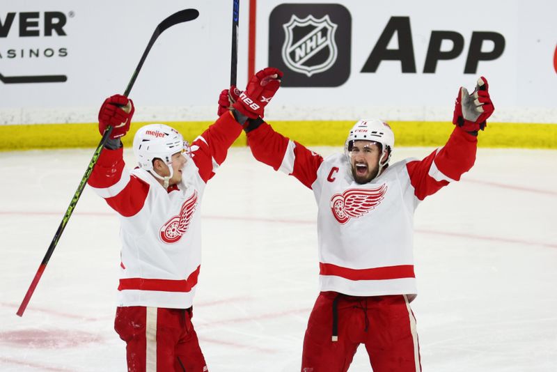 Jan 17, 2023; Tempe, Arizona, USA; Detroit Red Wings center Dylan Larkin (71) celebrates a goal with left wing Lucas Raymond (23) against the Arizona Coyotes in the second period at Mullett Arena. Mandatory Credit: Mark J. Rebilas-USA TODAY Sports