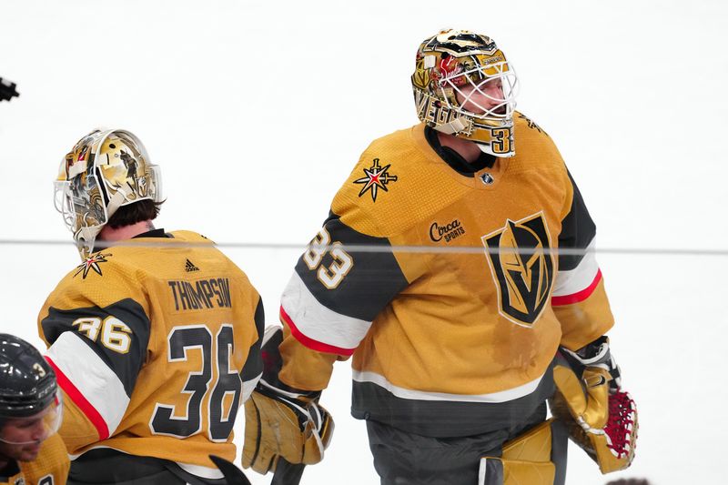 Feb 22, 2024; Las Vegas, Nevada, USA; Vegas Golden Knights goaltender Adin Hill (33) is replaced by Vegas Golden Knights goaltender Logan Thompson (36) after surrendering 3 goals against the Toronto Maple Leafs during the first period at T-Mobile Arena. Mandatory Credit: Stephen R. Sylvanie-USA TODAY Sports