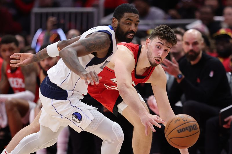 HOUSTON, TEXAS - JANUARY 01: Alperen Sengun #28 of the Houston Rockets goes for a loose ball against Kyrie Irving #11 of the Dallas Mavericks during the second half at Toyota Center on January 01, 2025 in Houston, Texas. NOTE TO USER: User expressly acknowledges and agrees that, by downloading and or using this photograph, User is consenting to the terms and conditions of the Getty Images License Agreement. (Photo by Alex Slitz/Getty Images)