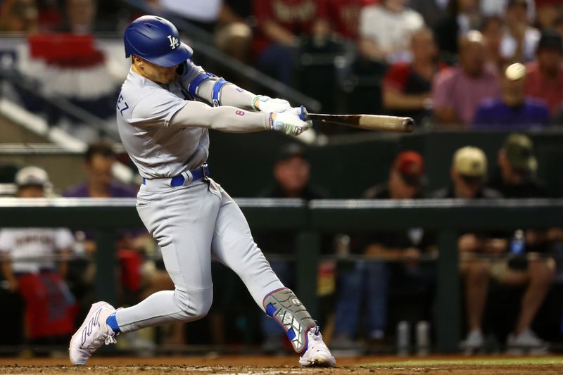 Oct 11, 2023; Phoenix, Arizona, USA; Los Angeles Dodgers shortstop Enrique Hernandez (8) hits a single against the Arizona Diamondbacks in the third inning for game three of the NLDS for the 2023 MLB playoffs at Chase Field. Mandatory Credit: Mark J. Rebilas-USA TODAY Sports