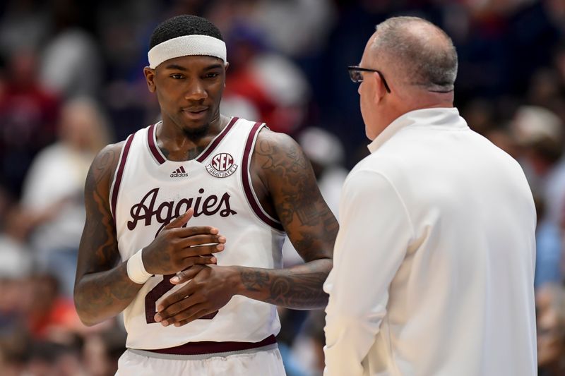 Mar 14, 2024; Nashville, TN, USA;  Texas A&M Aggies head coach Buzz Williams talks with Texas A&M Aggies guard Tyrece Radford (23) during the second half at Bridgestone Arena. Mandatory Credit: Steve Roberts-USA TODAY Sports