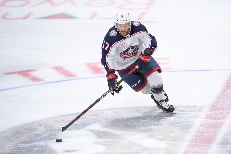 Feb 13, 2024; Ottawa, Ontario, CAN; Columbus Blue Jackets right wing Justin Danforth (17) skates with the puck in the third period against the Ottawa Senators at the Canadian Tire Centre. Mandatory Credit: Marc DesRosiers-USA TODAY Sports