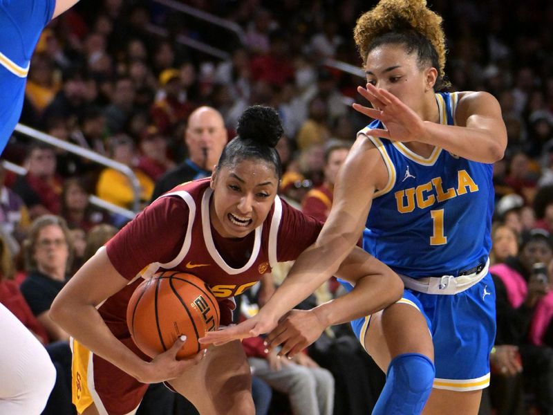 Jan 14, 2024; Los Angeles, California, USA; UCLA Bruins guard Kiki Rice (1) defends USC Trojans guard JuJu Watkins (12) in the second half at Galen Center. Mandatory Credit: Jayne Kamin-Oncea-USA TODAY Sports