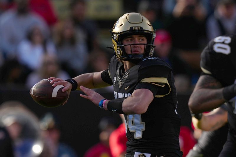 Nov 26, 2022; Boulder, Colorado, USA; Colorado Buffaloes quarterback Maddox Kopp (14) prepares to pass in the first quarter against the Utah Utes at Folsom Field. Mandatory Credit: Ron Chenoy-USA TODAY Sports