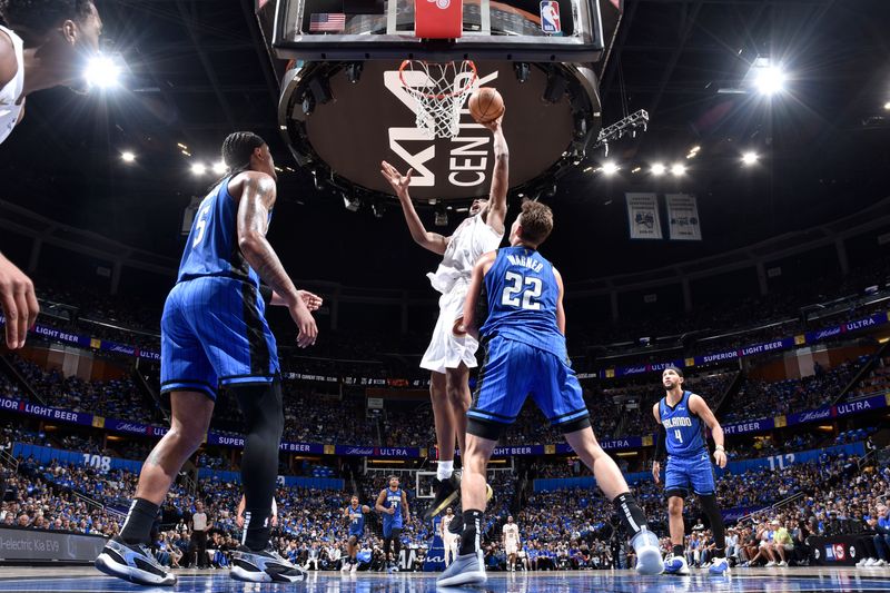 ORLANDO, FL - APRIL 27: Evan Mobley #4 of the Cleveland Cavaliers drives to the basket during the game against the Orlando Magic during Round 1 Game 4 of the 2024 NBA Playoffs on April 27, 2024 at the Kia Center in Orlando, Florida. NOTE TO USER: User expressly acknowledges and agrees that, by downloading and or using this photograph, User is consenting to the terms and conditions of the Getty Images License Agreement. Mandatory Copyright Notice: Copyright 2024 NBAE (Photo by Fernando Medina/NBAE via Getty Images)