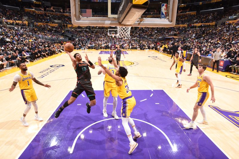 LOS ANGELES, CA - FEBRUARY 29: Jordan Poole #13 of the Washington Wizards drives to the basket during the game against the Los Angeles Lakers on February 29, 2024 at Crypto.Com Arena in Los Angeles, California. NOTE TO USER: User expressly acknowledges and agrees that, by downloading and/or using this Photograph, user is consenting to the terms and conditions of the Getty Images License Agreement. Mandatory Copyright Notice: Copyright 2024 NBAE (Photo by Andrew D. Bernstein/NBAE via Getty Images)