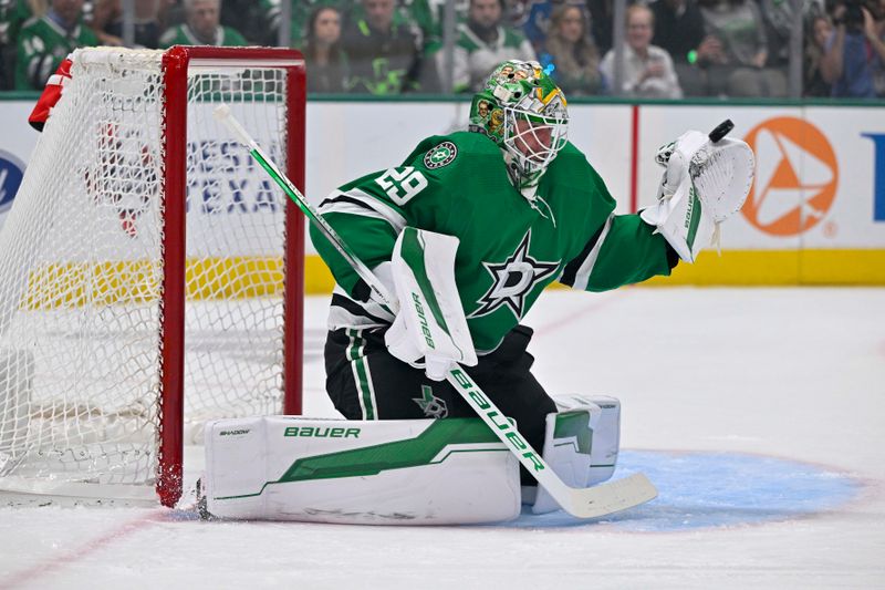 May 15, 2024; Dallas, Texas, USA; Dallas Stars goaltender Jake Oettinger (29) makes a glove save on a Colorado Avalanche shot during the first period in game five of the second round of the 2024 Stanley Cup Playoffs at American Airlines Center. Mandatory Credit: Jerome Miron-USA TODAY Sports