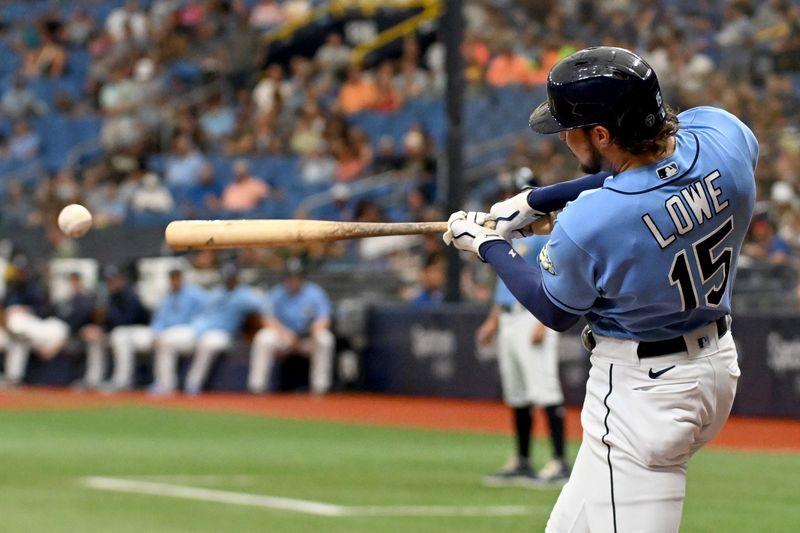 Sep 10, 2023; St. Petersburg, Florida, USA; Tampa Bay Rays right fielder Josh Lowe (15) hits a RBI double in the first inning against the Seattle Mariners  at Tropicana Field. Mandatory Credit: Jonathan Dyer-USA TODAY Sports