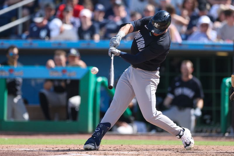 Mar 1, 2026; Clearwater, Florida, USA; New York Yankees right fielder Seth Brown (26) hits an rbi single against the New York Yankees in the fifth inning during spring training at BayCare Ballpark. Mandatory Credit: Nathan Ray Seebeck-Imagn Images