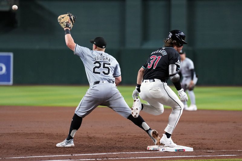 Jun 15, 2024; Phoenix, Arizona, USA; Arizona Diamondbacks outfielder Jake McCarthy (31) beats a throw to Chicago White Sox first base Andrew Vaughn (25) for an infield single during the second inning at Chase Field. Mandatory Credit: Joe Camporeale-USA TODAY Sports