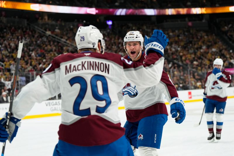 Oct 9, 2024; Las Vegas, Nevada, USA; Colorado Avalanche right wing Mikko Rantanen (96) celebrates with center Nathan MacKinnon (29) after scoring a goal against the Vegas Golden Knights during the first period at T-Mobile Arena. Mandatory Credit: Lucas Peltier-Imagn Images