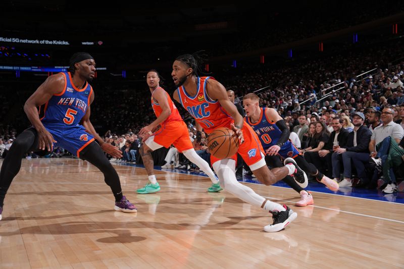 NEW YORK, NY - MARCH 31: Isaiah Joe #11 of the Oklahoma City Thunder dribbles the ball during the game against the New York Knicks on March 31, 2024 at Madison Square Garden in New York City, New York.  NOTE TO USER: User expressly acknowledges and agrees that, by downloading and or using this photograph, User is consenting to the terms and conditions of the Getty Images License Agreement. Mandatory Copyright Notice: Copyright 2024 NBAE  (Photo by Jesse D. Garrabrant/NBAE via Getty Images)