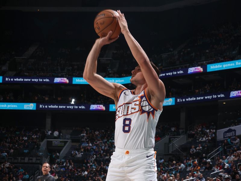 CHARLOTTE, NC - MARCH 15:  Grayson Allen #8 of the Phoenix Suns shoots a 3-point basket during the game  on March 15, 2024 at Spectrum Center in Charlotte, North Carolina. NOTE TO USER: User expressly acknowledges and agrees that, by downloading and or using this photograph, User is consenting to the terms and conditions of the Getty Images License Agreement.  Mandatory Copyright Notice:  Copyright 2024 NBAE (Photo by Kent Smith/NBAE via Getty Images)