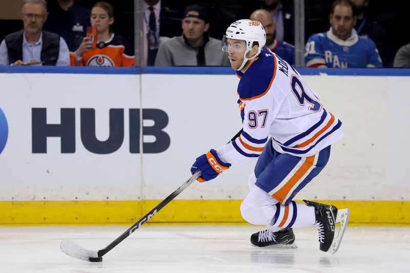 Oct 14, 2025; New York, New York, USA; Edmonton Oilers center Connor McDavid (97) skates with the puck against the New York Rangers during the third period at Madison Square Garden. Mandatory Credit: Brad Penner-Imagn Images