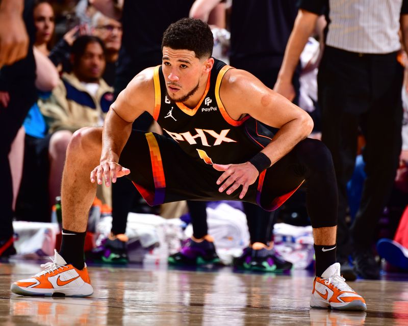 PHOENIX, AZ - APRIL 16:  Devin Booker #1 of the Phoenix Suns looks on during the game During round one game one of the 2023 NBA Playoffs on April 16, 2023 at Footprint Center in Phoenix, Arizona. NOTE TO USER: User expressly acknowledges and agrees that, by downloading and or using this photograph, user is consenting to the terms and conditions of the Getty Images License Agreement. Mandatory Copyright Notice: Copyright 2023 NBAE (Photo by Barry Gossage/NBAE via Getty Images)