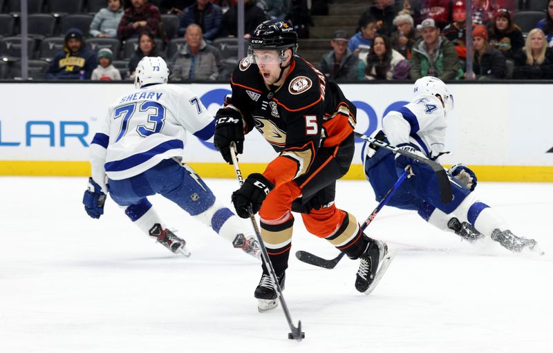 Mar 24, 2024; Anaheim, California, USA; Anaheim Ducks defenseman Urho Vaakanainen passes during the first period against the Tampa Bay Lightning at Honda Center. Mandatory Credit: Jason Parkhurst-USA TODAY Sports