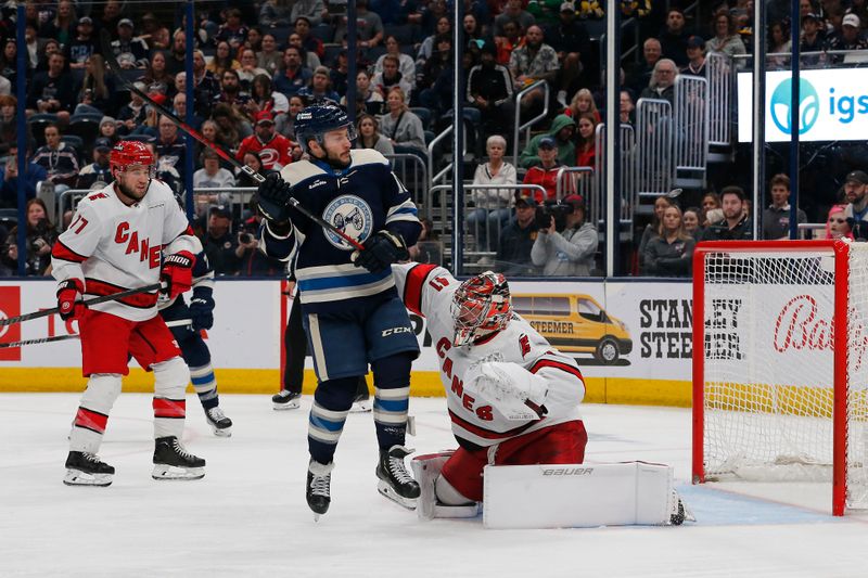 Apr 16, 2024; Columbus, Ohio, USA; Columbus Blue Jackets right wing Justin Danforth (17) screens Carolina Hurricanes goalie Spencer Martin (41) on a shot during the second period at Nationwide Arena. Mandatory Credit: Russell LaBounty-USA TODAY Sports