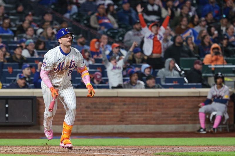 May 12, 2024; New York City, New York, USA; New York Mets first baseman Pete Alonso (20) hits an RBI double during the sixth inning against the Atlanta Braves at Citi Field. Mandatory Credit: Vincent Carchietta-USA TODAY Sports