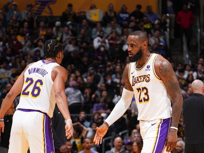 LOS ANGELES, CA - MARCH 24:  Spencer Dinwiddie #26  high fives LeBron James #23 of the Los Angeles Lakers during the game against the Indiana Pacers on March 24, 2024 at Crypto.Com Arena in Los Angeles, California. NOTE TO USER: User expressly acknowledges and agrees that, by downloading and/or using this Photograph, user is consenting to the terms and conditions of the Getty Images License Agreement. Mandatory Copyright Notice: Copyright 2024 NBAE (Photo by Garrett Ellwood/NBAE via Getty Images)