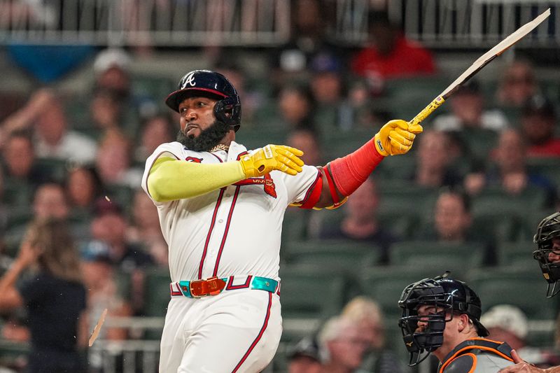 Jun 17, 2024; Cumberland, Georgia, USA; Atlanta Braves designated hitter Marcell Ozuna (20) breaks his bat while popping out against the Detroit Tigers during the sixth inning at Truist Park. Mandatory Credit: Dale Zanine-USA TODAY Sports