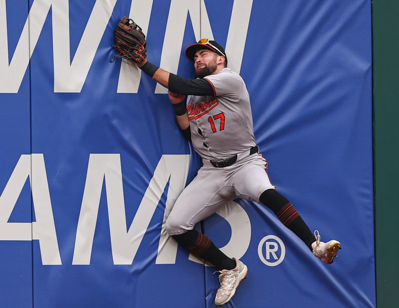 Aug 6, 2025; Philadelphia, Pennsylvania, USA; Baltimore Orioles outfielder Colton Cowser (17) runs into the wall while catching a pop up for an out against the Philadelphia Phillies during the sixth inning at Citizens Bank Park. Mandatory Credit: Bill Streicher-Imagn Images