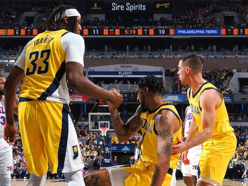 INDIANAPOLIS, IN - OCTOBER 27: Obi Toppin #1 of the Indiana Pacers is helped up during the game against the Philadelphia 76ers on October 27, 2024 at Gainbridge Fieldhouse in Indianapolis, Indiana. NOTE TO USER: User expressly acknowledges and agrees that, by downloading and or using this Photograph, user is consenting to the terms and conditions of the Getty Images License Agreement. Mandatory Copyright Notice: Copyright 2024 NBAE (Photo by Ron Hoskins/NBAE via Getty Images)