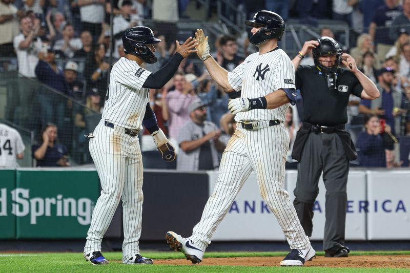 May 2, 2025; Bronx, New York, USA; New York Yankees first baseman Paul Goldschmidt (48) celebrates his three run home run during the fifth inning with second baseman Jorbit Vivas (90) against the Tampa Bay Rays at Yankee Stadium. Mandatory Credit: Vincent Carchietta-Imagn Images