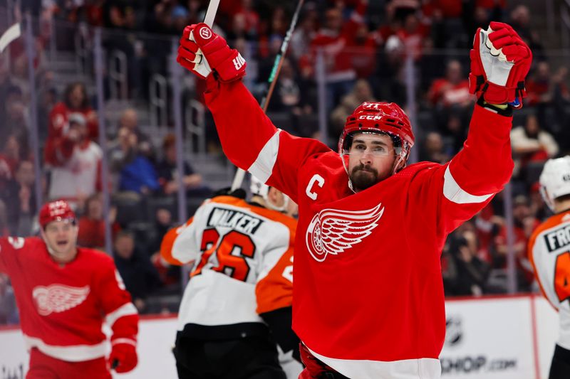 Jan 25, 2024; Detroit, Michigan, USA;  Detroit Red Wings center Dylan Larkin (71) celebrates after he score a goal in the second period against the Philadelphia Flyers at Little Caesars Arena. Mandatory Credit: Rick Osentoski-USA TODAY Sports