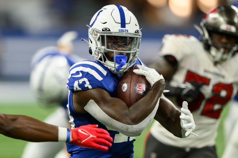 Indianapolis Colts running back Ty'Son Williams (43) runs up the middle during an NFL football game against the Tampa Bay Buccaneers, Saturday, Aug. 27, 2022, in Indianapolis. (AP Photo/Zach Bolinger)