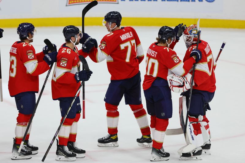 Oct 8, 2024; Sunrise, Florida, USA; Florida Panthers goaltender Sergei Bobrovsky (72) celebrates with teammates after the game against the Boston Bruins at Amerant Bank Arena. Mandatory Credit: Sam Navarro-Imagn Images