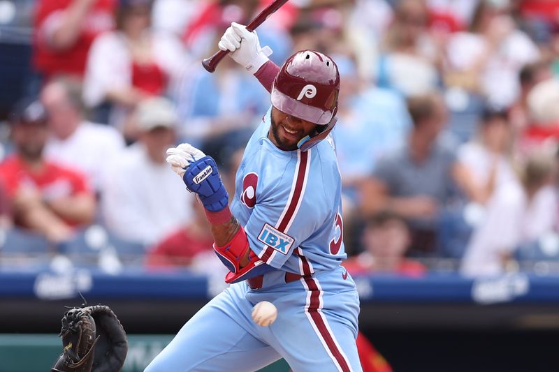 May 29, 2025; Philadelphia, Pennsylvania, USA; Philadelphia Phillies second base Edmundo Sosa (33) is hit by a pitch during the sixth inning against the Atlanta Braves at Citizens Bank Park. Mandatory Credit: Bill Streicher-Imagn Images