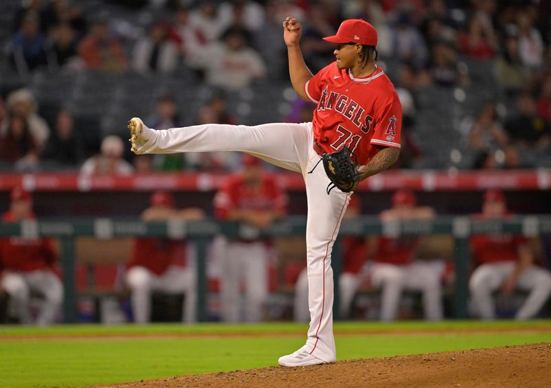 Sep 27, 2023; Anaheim, California, USA; Los Angeles Angels relief pitcher Kelvin Caceres (71) throws to the plate in his major league debut in the ninth inning against the Texas Rangers at Angel Stadium. Mandatory Credit: Jayne Kamin-Oncea-USA TODAY Sports